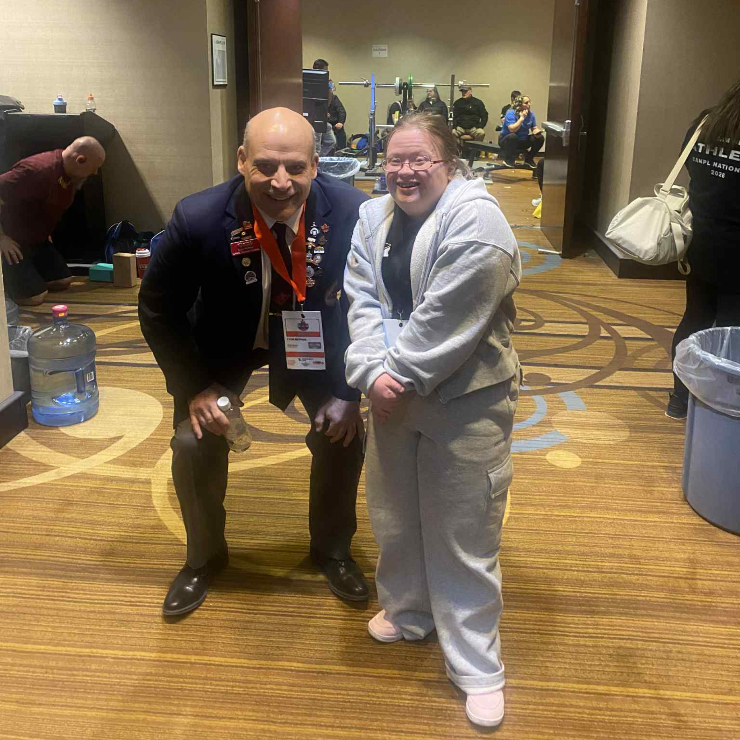 Tyler posing with a junior special Olympian.